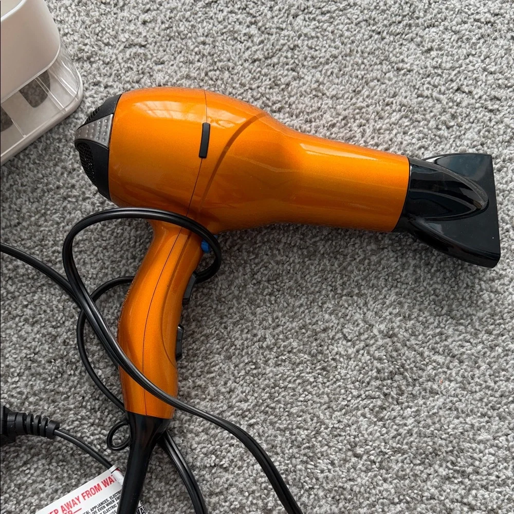 Orange Travel Hair Dryer with Foldable Handle organizer
